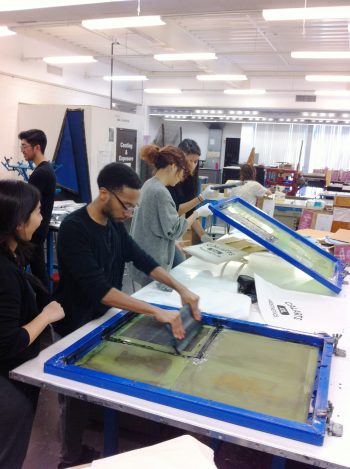 BFA students printing an array of submitted designs
